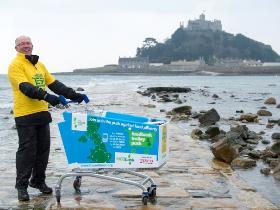 Bob pushing a shopping trolley in front of Marazion, Cornwall